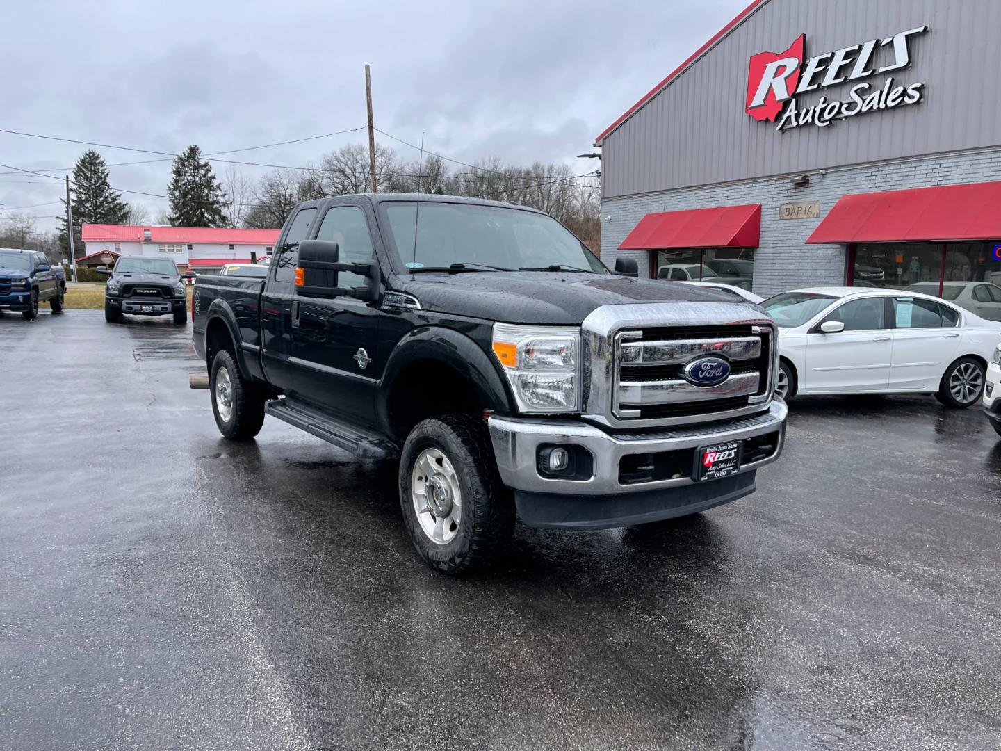 2015 Green /Gray Ford F-250 SD XLT SuperCab Long Bed 4WD (1FT7X2BT6FE) with an 6.7L V8 OHV 16V DIESEL engine, 6-Speed Automatic transmission, located at 547 E. Main St., Orwell, OH, 44076, (440) 437-5893, 41.535435, -80.847855 - Photo#2